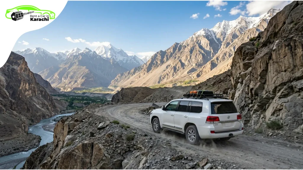 This image is a photo of the Toyota Land Cruiser LC200 from Image 1, now driving through the rugged mountains on the way to Skardu